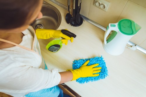 Office regular cleaning of desks and shared surfaces