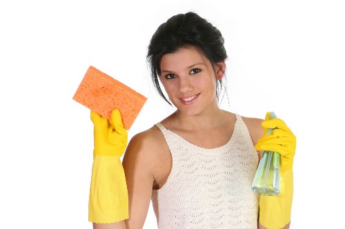 Detailed Airbnb cleaning in a modern kitchen and dining area