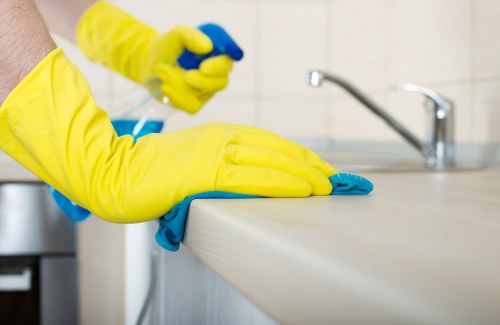 Technician performing deep carpet cleaning with extraction equipment