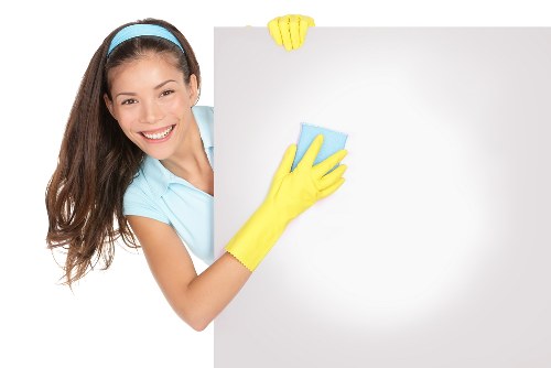 Final move out cleaning touches in an empty bedroom